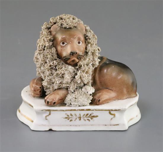 A Lloyd Shelton porcelain group of a lion and a lamb, c.1840, length 12cm, shallow foot chip